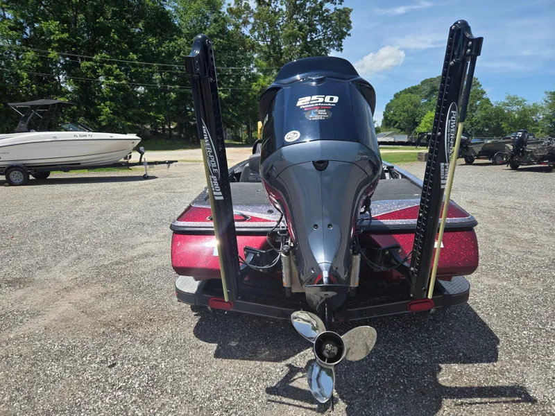 Slide: The Image of 2018 Skeeter ZX 250 boat with powerful engine, parked outdoors on a sunny day. - 18