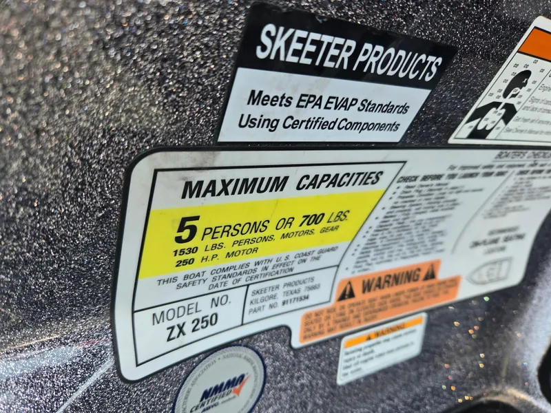 Slide: The Image of 2018 Skeeter ZX 250 capacity label, maximum 5 persons or 700 lbs, meets EPA standards. - 5