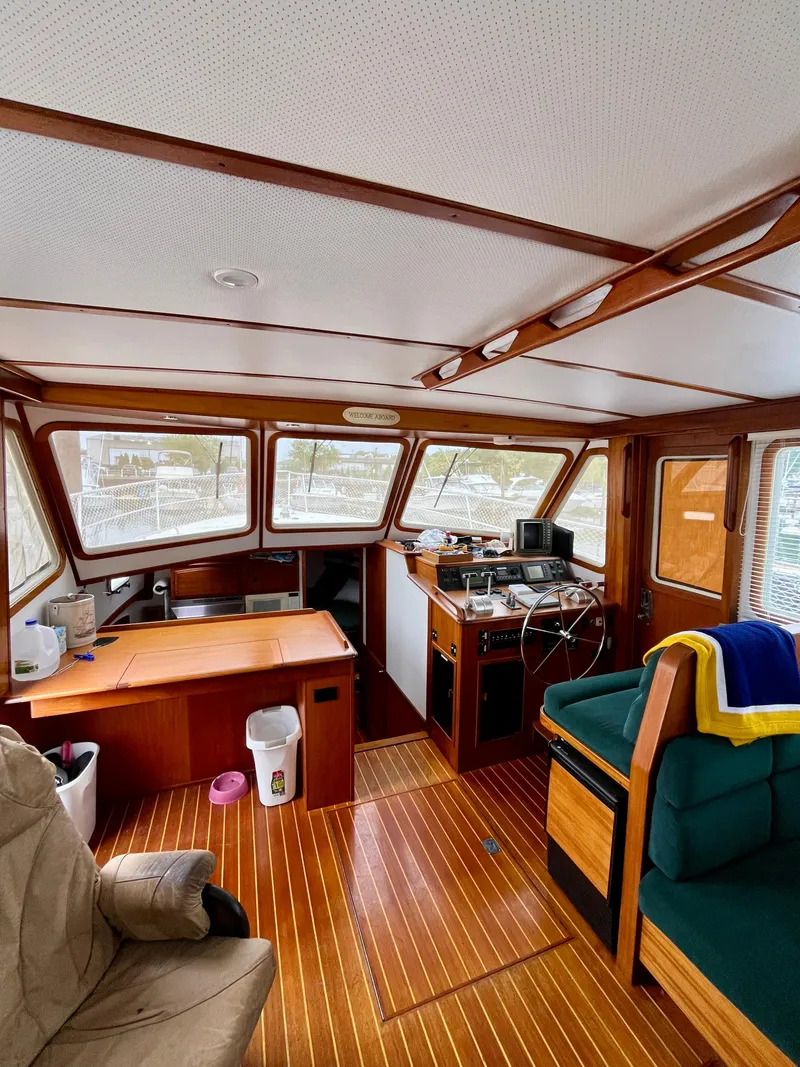 Slide: The Image of Interior of 1996 Sabreline 43 Motoryacht with wood flooring and helm station. - 13