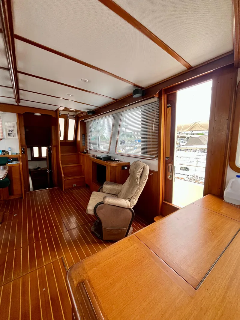 Slide: The Image of Interior of 1996 Sabreline 43 Motoryacht with wooden flooring and comfortable seating. - 14