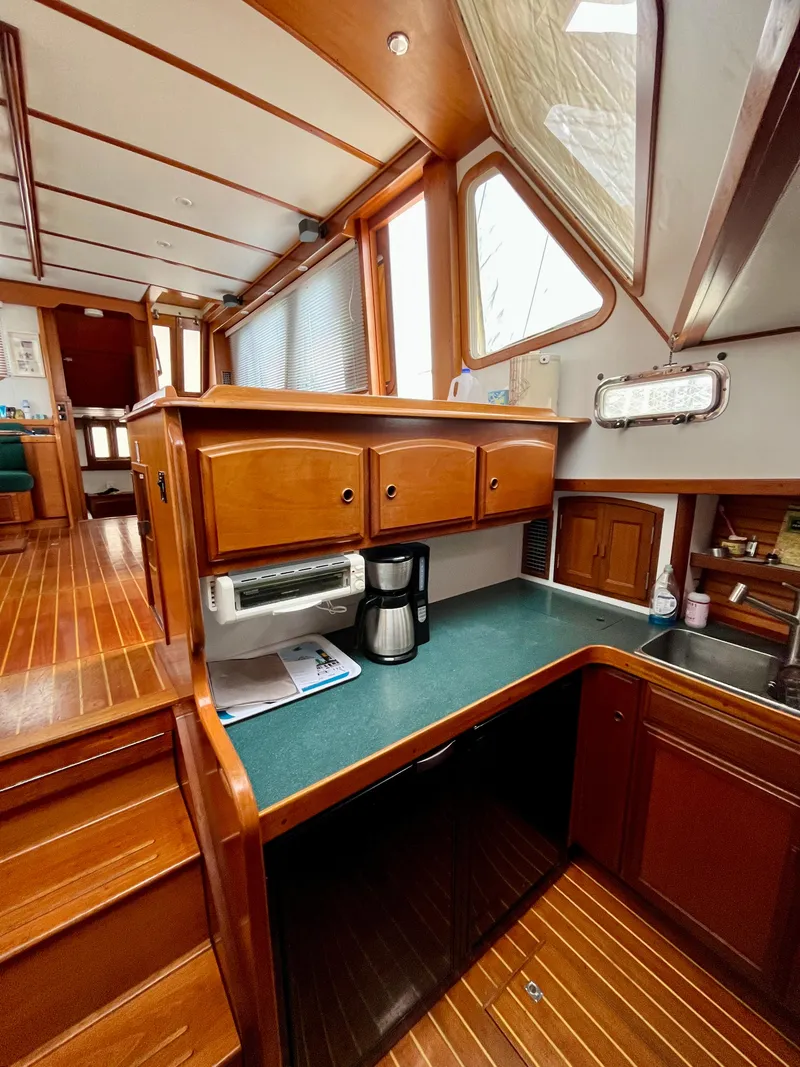 Slide: The Image of Interior of 1996 Sabreline 43 Motoryacht with wooden cabinetry and countertop. - 18