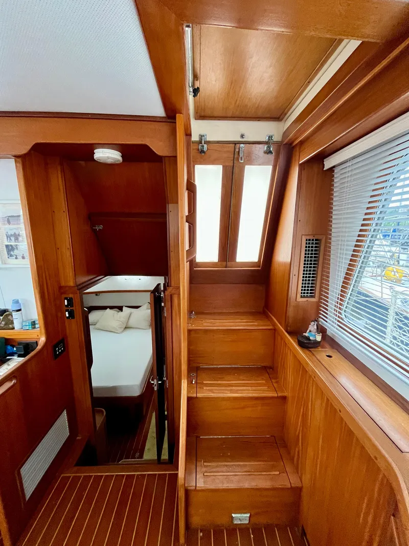 Slide: The Image of Interior of 1996 Sabreline 43 Motoryacht with wooden stairs and cozy cabin. - 21