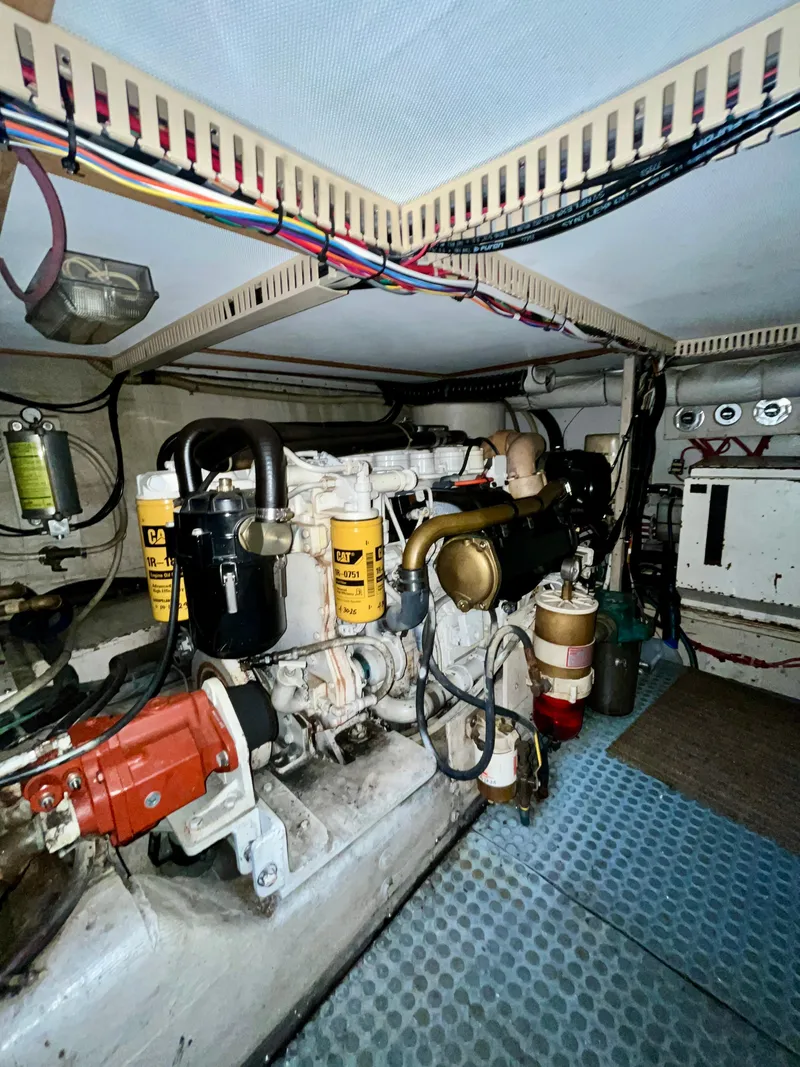 Slide: The Image of Engine room of 1996 Sabreline 43 Motoryacht with visible machinery and wiring. - 27