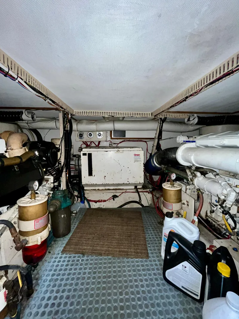 Slide: The Image of Engine room of 1996 Sabreline 43 Motoryacht with visible machinery and equipment. - 28