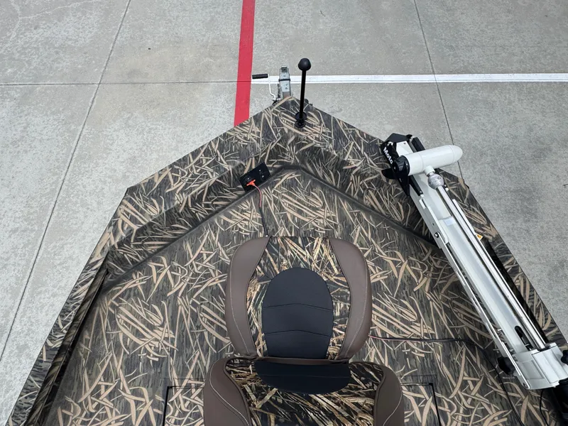 Slide: The Image of 2016 Crestliner 2000 Bay boat with camo design and mounted equipment. - 19