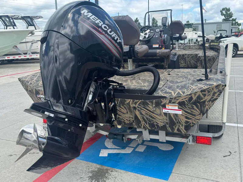 Slide: The Image of 2016 Crestliner 2000 Bay boat with Mercury outboard motor in parking lot. - 6
