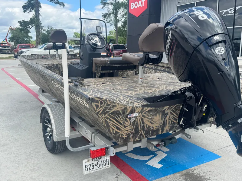 Slide: The Image of 2016 Crestliner 2000 Bay boat with camouflage design and Mercury outboard motor. - 7