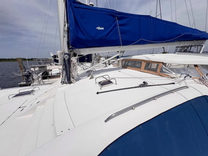 Slide: The Image of 2007 Leopard 43 sailboat with blue sail cover, docked at marina. - 16
