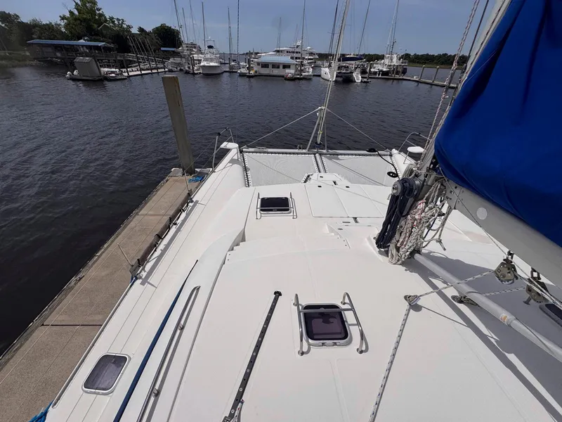Slide: The Image of Sailboat docked at marina, Leopard 43 model, 2007, with visible deck and rigging. - 18