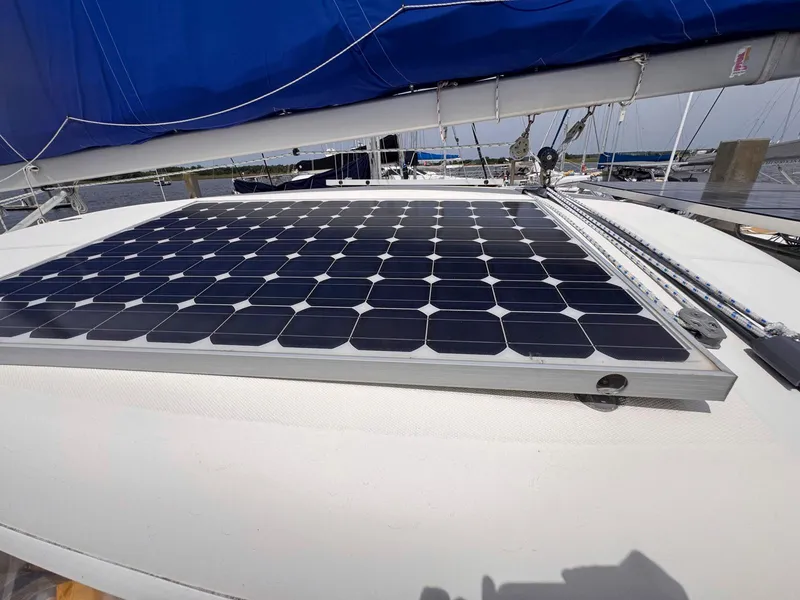 Slide: The Image of Solar panel on 2007 Leopard 43 catamaran with blue sail in marina. - 19