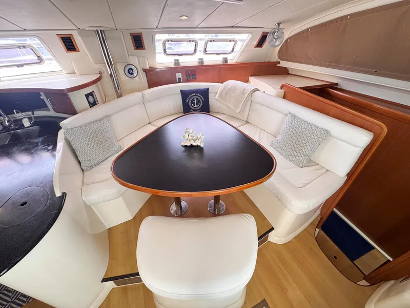 Slide: The Image of Luxurious interior of a 2007 Leopard 43 catamaran with elegant seating and table. - 20