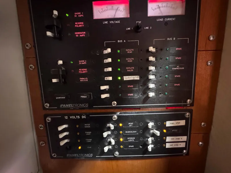 Slide: The Image of Electrical control panel on a 2007 Leopard 43 boat, featuring switches and indicators. - 34