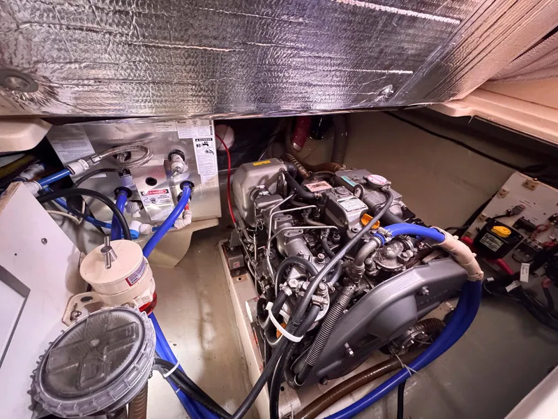 Slide: The Image of Engine room of a 2007 Leopard 43 yacht, featuring mechanical components and wiring. - 38