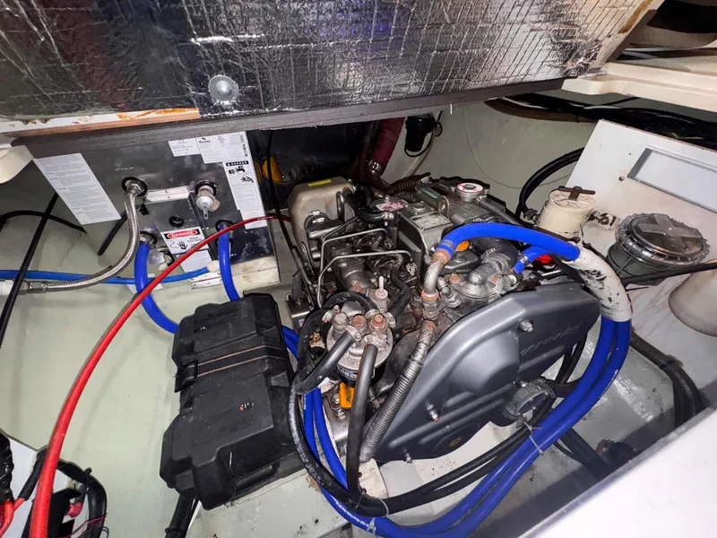 Slide: The Image of Engine compartment of a 2007 Leopard 43 boat, featuring wiring and mechanical components. - 39