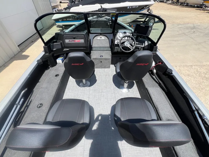 Slide: The Image of 2007 Lund 1800 Pro-V SE boat interior with four seats and steering console. - 10
