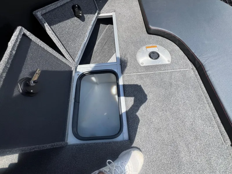 Slide: The Image of 2007 Lund 1800 Pro-V SE boat interior with open storage compartments. - 14