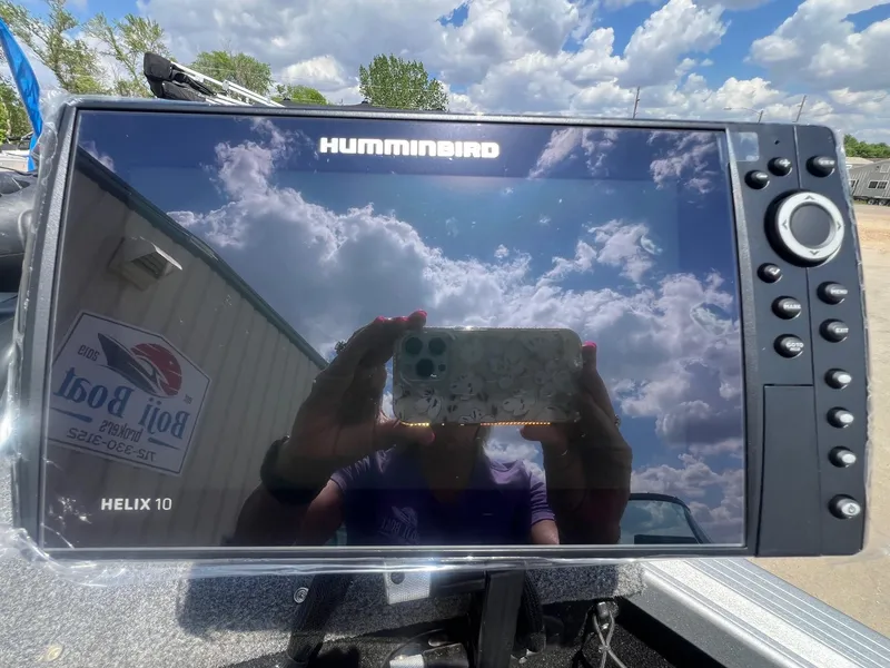 Slide: The Image of Humminbird Helix 10 fish finder on a 2007 Lund 1800 Pro-V SE boat, reflecting cloudy sky. - 17