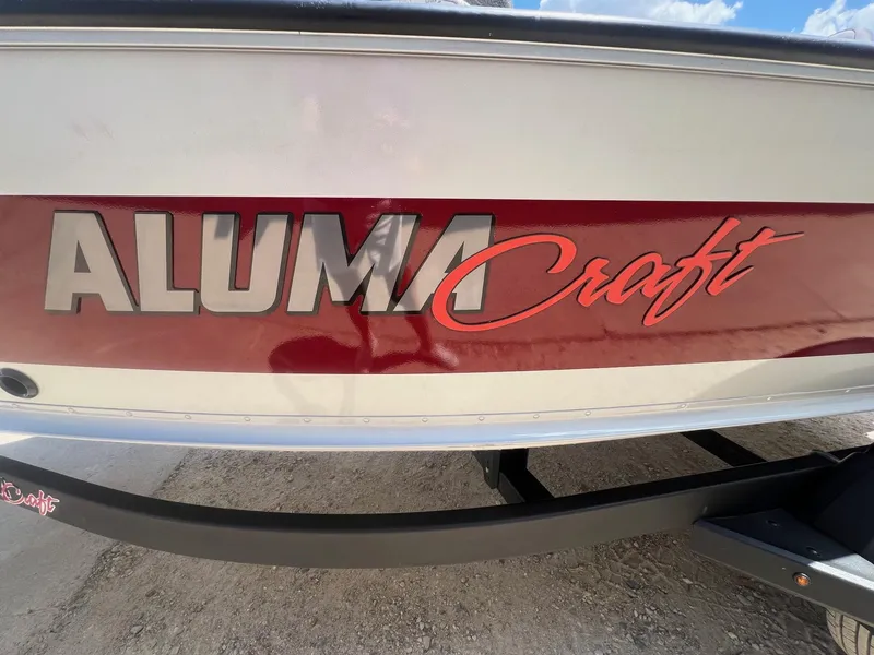 Slide: The Image of Close-up of Alumacraft logo on a 2007 Lund 1800 Pro-V SE boat. - 2