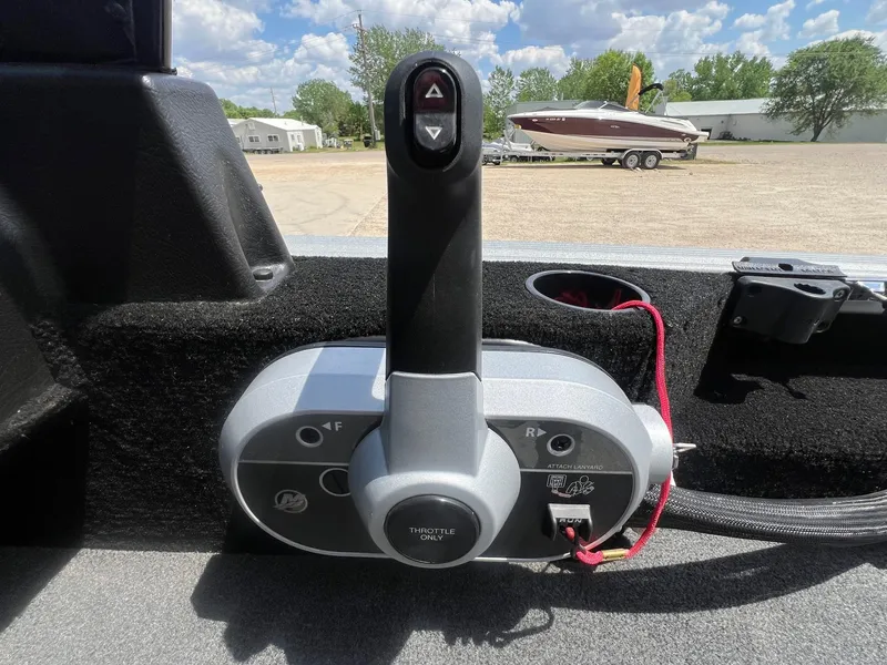 Slide: The Image of Boat throttle control on a 2007 Lund 1800 Pro-V SE, with a scenic outdoor background. - 27