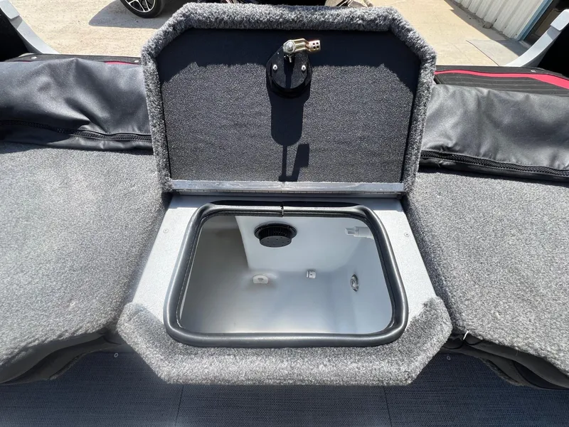 Slide: The Image of 2007 Lund 1800 Pro-V SE boat storage compartment with open lid, showing interior space. - 31