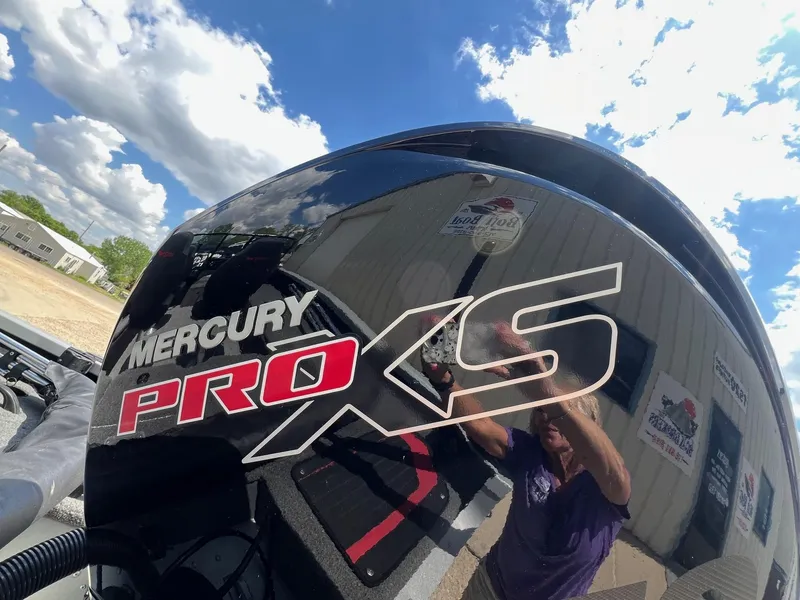 Slide: The Image of Mercury Pro XS engine on a 2007 Lund 1800 Pro-V SE boat under a blue sky. - 7