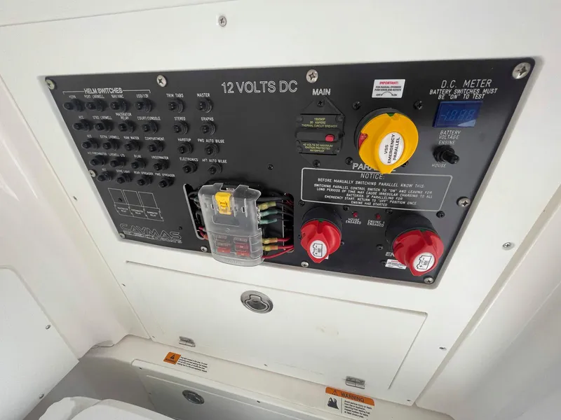 Slide: The Image of Electrical panel of 2023 Caymas 26 HB boat, featuring 12 volts DC system. - 14
