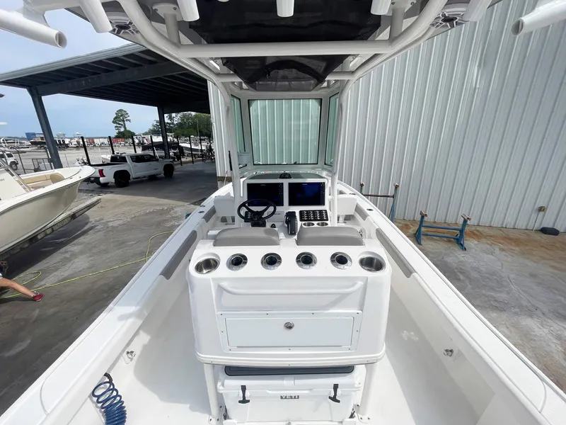 Slide: The Image of 2023 Caymas 26 HB boat interior with modern console and steering wheel. - 8