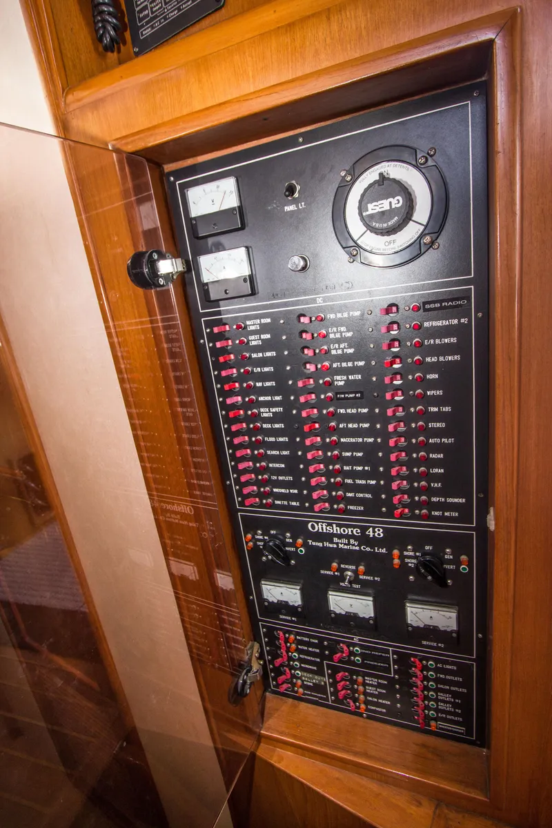 Slide: The Image of Electrical panel of a 1992 Offshore Yachts Sedan, showcasing controls and gauges. - 11