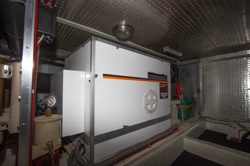 Slide: The Image of Engine room of 1992 Offshore Yachts Sedan with generator and equipment. - 38