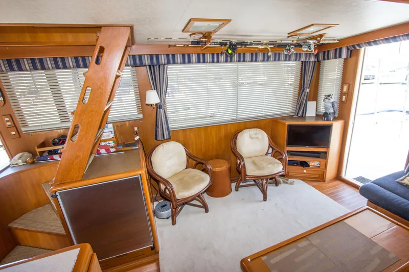 Slide: The Image of Interior of 1992 Offshore Yachts Sedan with wooden decor and comfortable seating. - 6