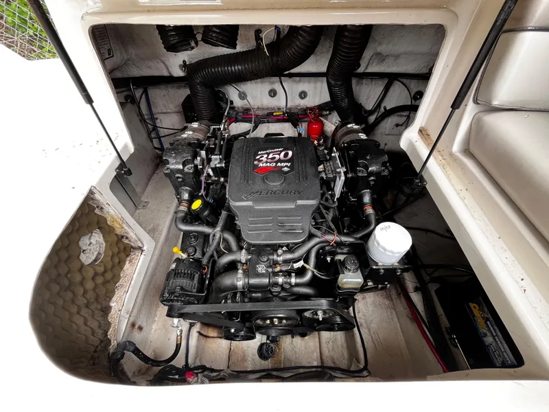 Slide: The Image of Engine compartment of a 2004 Sea Ray 240 Sundeck boat, featuring a 350 MAG MPI engine. - 16