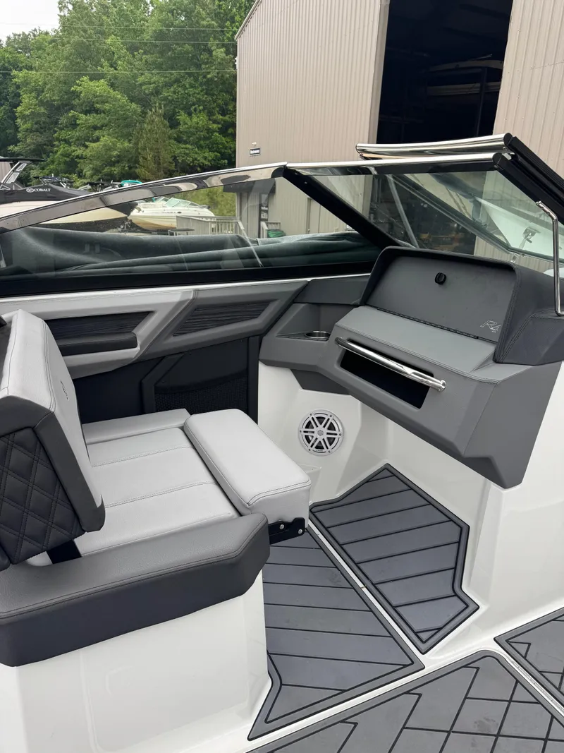 Slide: The Image of 2023 Cobalt R4 boat interior with sleek seating and modern dashboard design. - 10