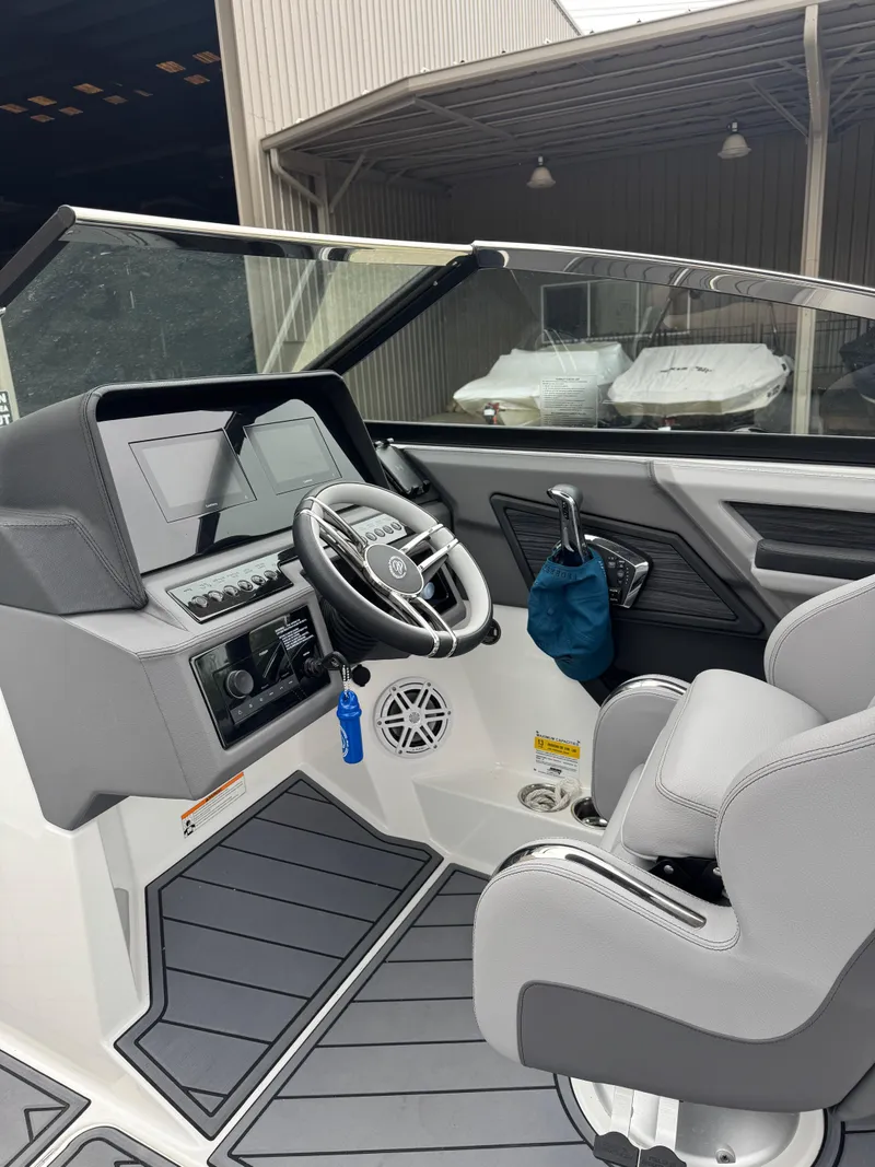 Slide: The Image of 2023 Cobalt R4 boat interior with modern dashboard and steering wheel. - 11