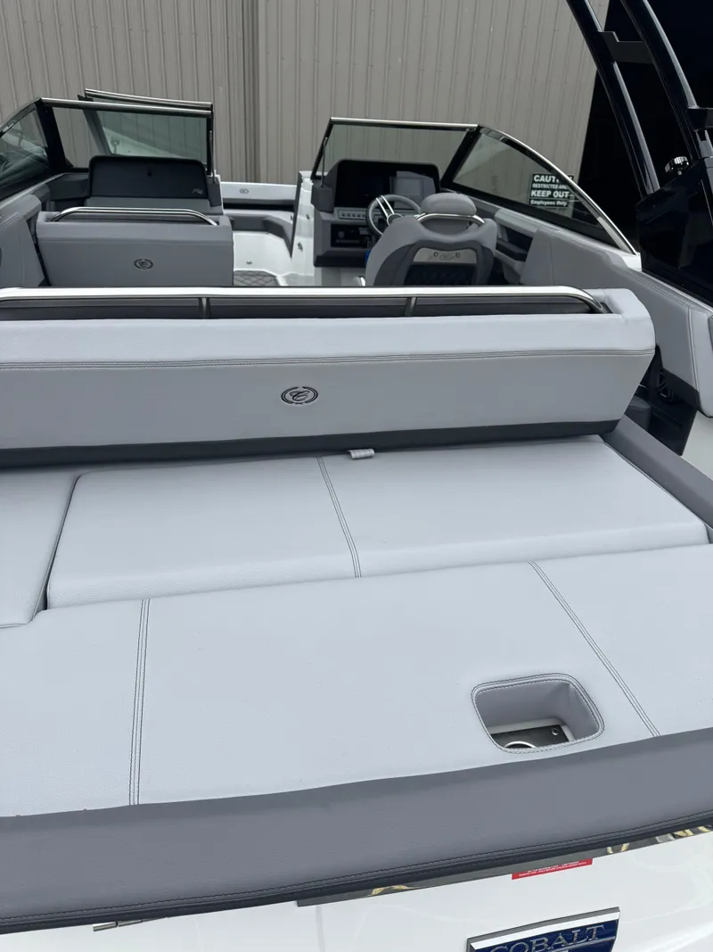 Slide: The Image of 2023 Cobalt R4 boat interior with sleek seating and modern dashboard design. - 6