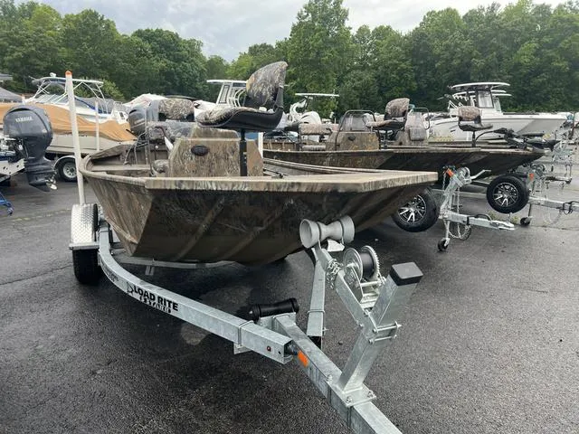 Slide: The Image of 2023 G3 17 CCJ boat on trailer, parked in a lot with other boats. - 8