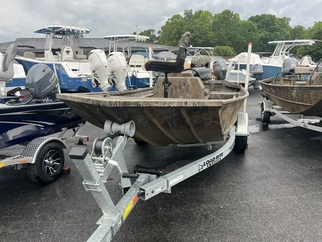 Slide: The Image of 2023 G3 17 CCJ boat on trailer, surrounded by other boats in a marina. - 9