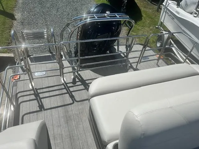 Slide: The Image of 2022 Sylvan Mirage X3 Tri Toon boat deck with seating and railing. - 14
