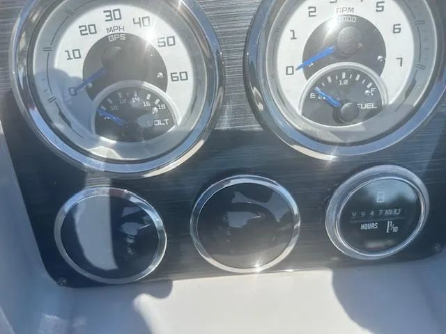 Slide: The Image of Dashboard of 2022 Sylvan Mirage X3 Tri Toon with speedometer and fuel gauge. - 5