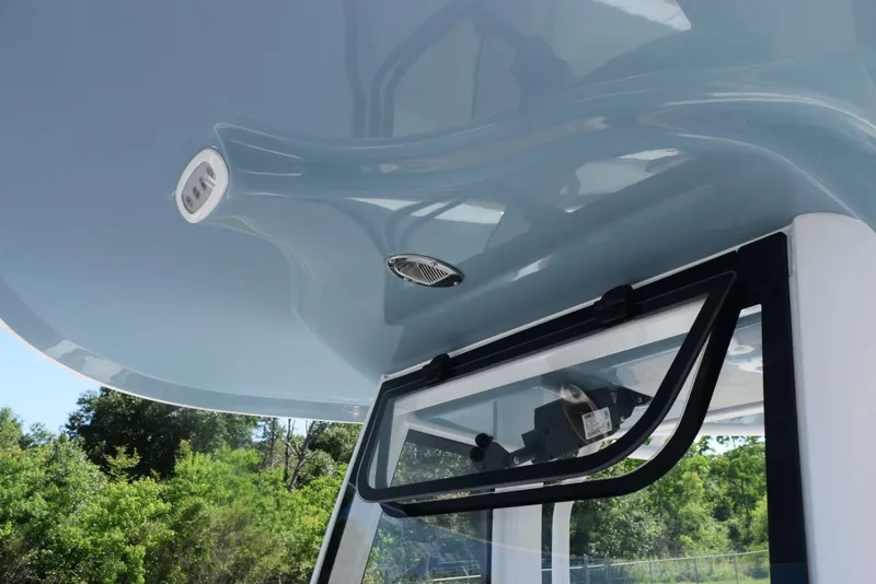 Slide: The Image of 2025 Sea Hunt Ultra 245 SE boat canopy and window detail, showcasing sleek design and modern features. - 14