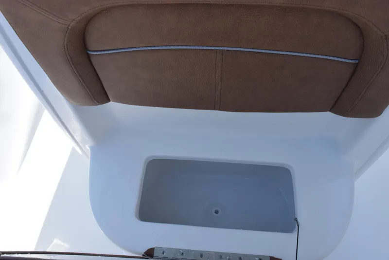 Slide: The Image of 2025 Sea Hunt Ultra 245 SE boat seat and storage compartment. - 16