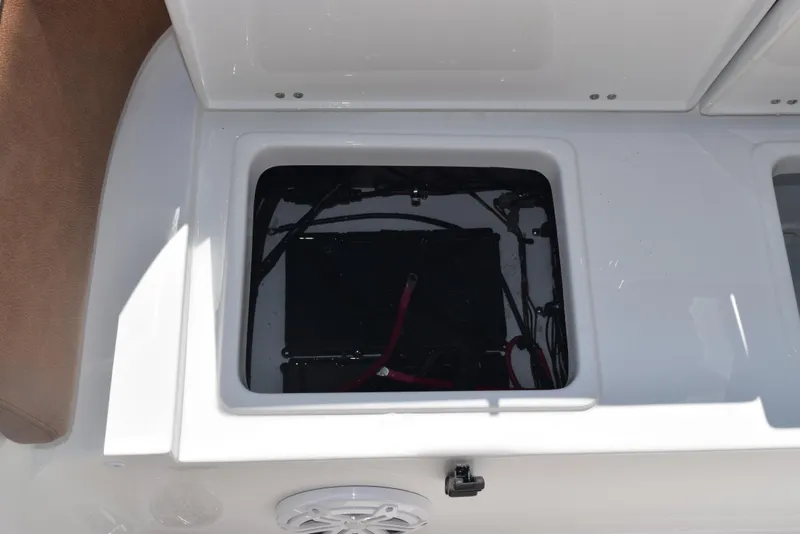 Slide: The Image of Open storage compartment on 2025 Sea Hunt Ultra 245 SE boat. - 21
