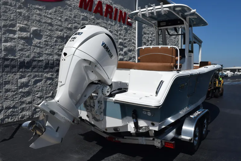 Slide: The Image of 2025 Sea Hunt Ultra 245 SE boat with Yamaha outboard motor on trailer. - 3