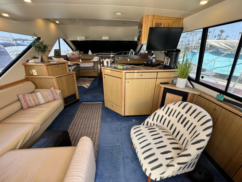 Slide: The Image of Luxurious interior of a 2000 Bayliner 3988 yacht with modern furnishings and spacious layout. - 24