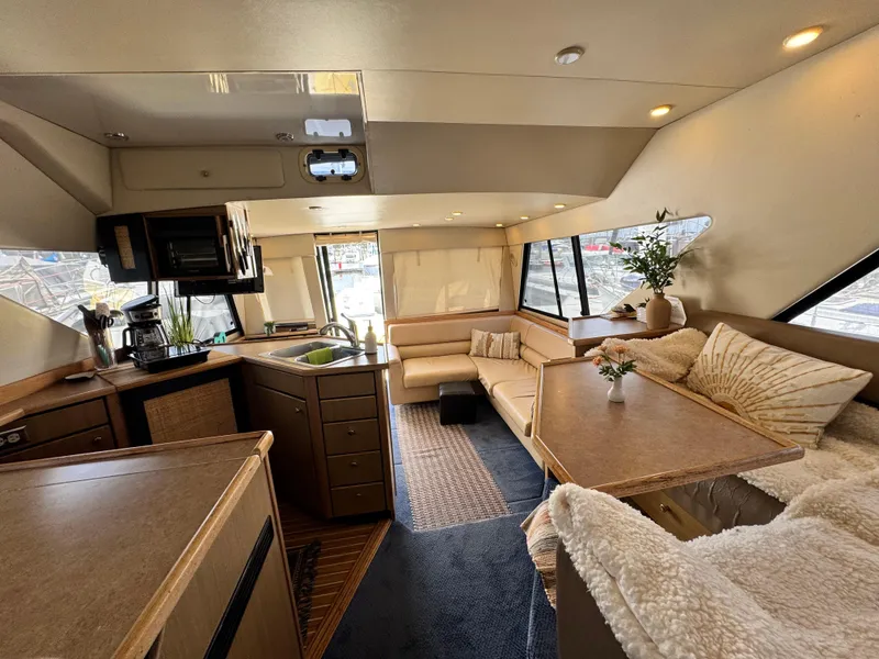 Slide: The Image of Luxurious interior of 2000 Bayliner 3988 yacht with cozy seating and modern kitchen. - 41