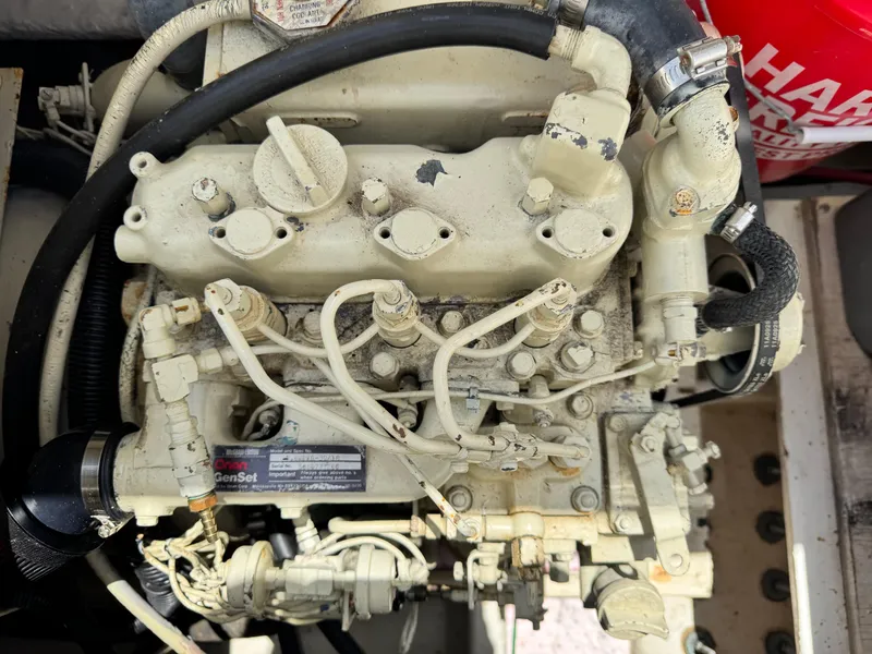 Slide: The Image of Engine of a 2000 Bayliner 3988 boat, showcasing intricate mechanical components. - 48