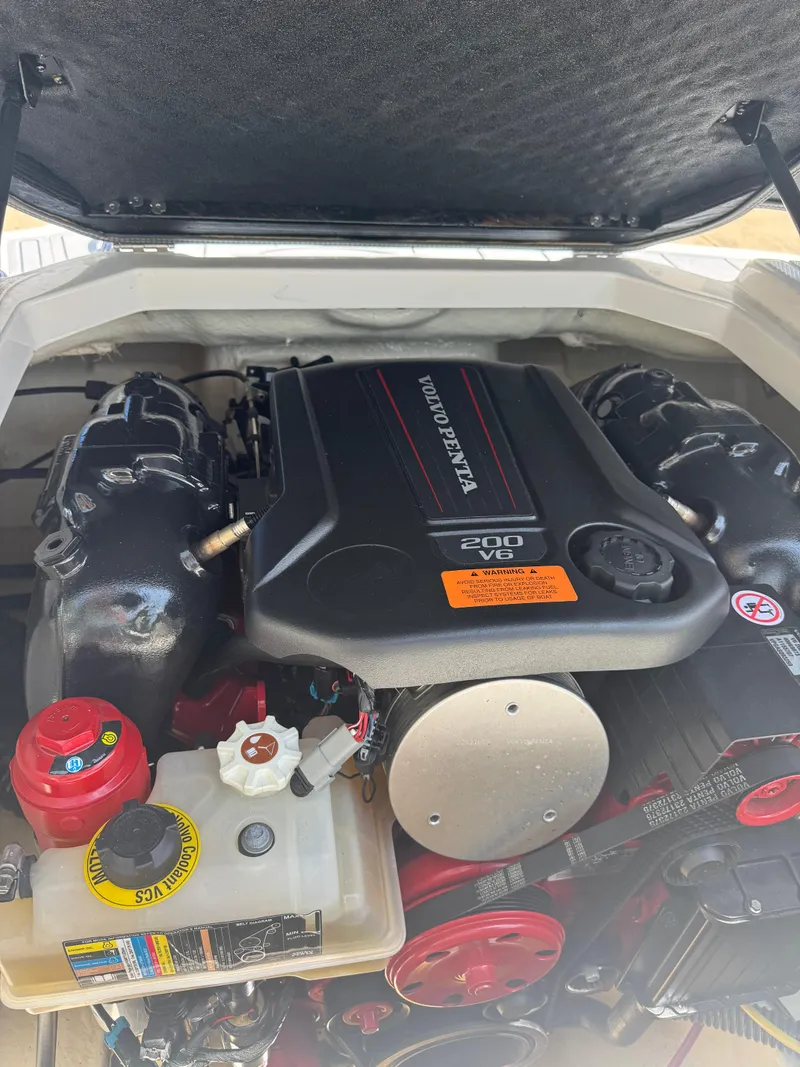Slide: The Image of 2022 Chaparral 21 SSi boat engine, featuring a Volvo Penta 200 V6. - 2