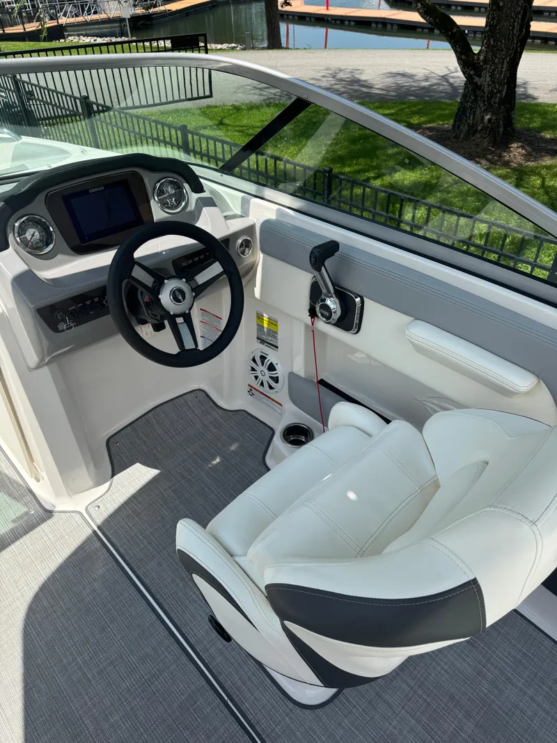 Slide: The Image of 2022 Chaparral 21 SSi boat interior with steering wheel and captain's seat. - 5