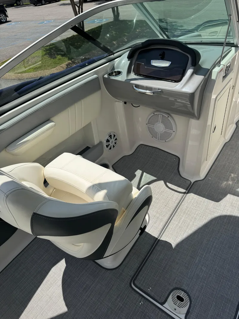 Slide: The Image of 2022 Chaparral 21 SSi boat interior with helm and seating area. - 5