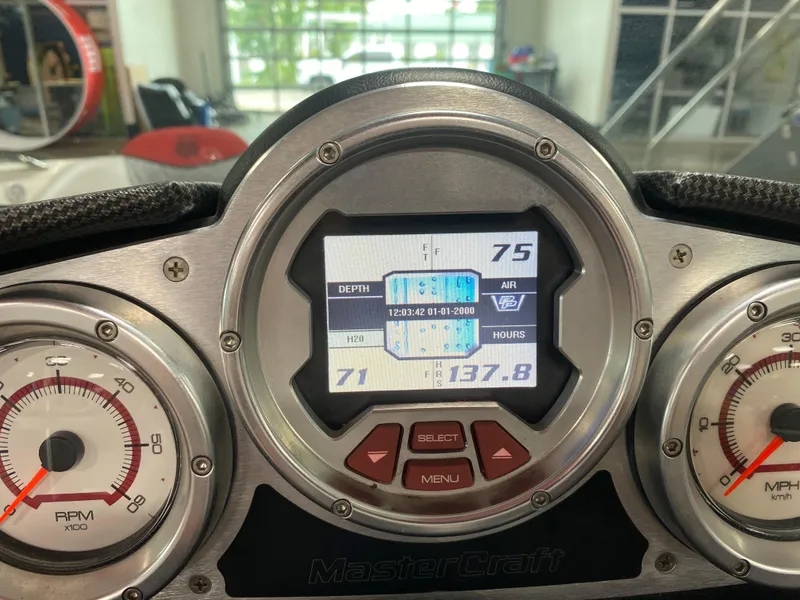 Slide: The Image of Dashboard of a 2011 MasterCraft X14 boat showing RPM, depth, and air temperature. - 29