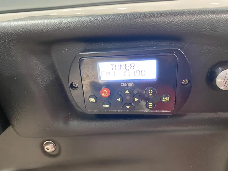 Slide: The Image of Clarion radio display in 2011 MasterCraft X14 boat dashboard. - 31